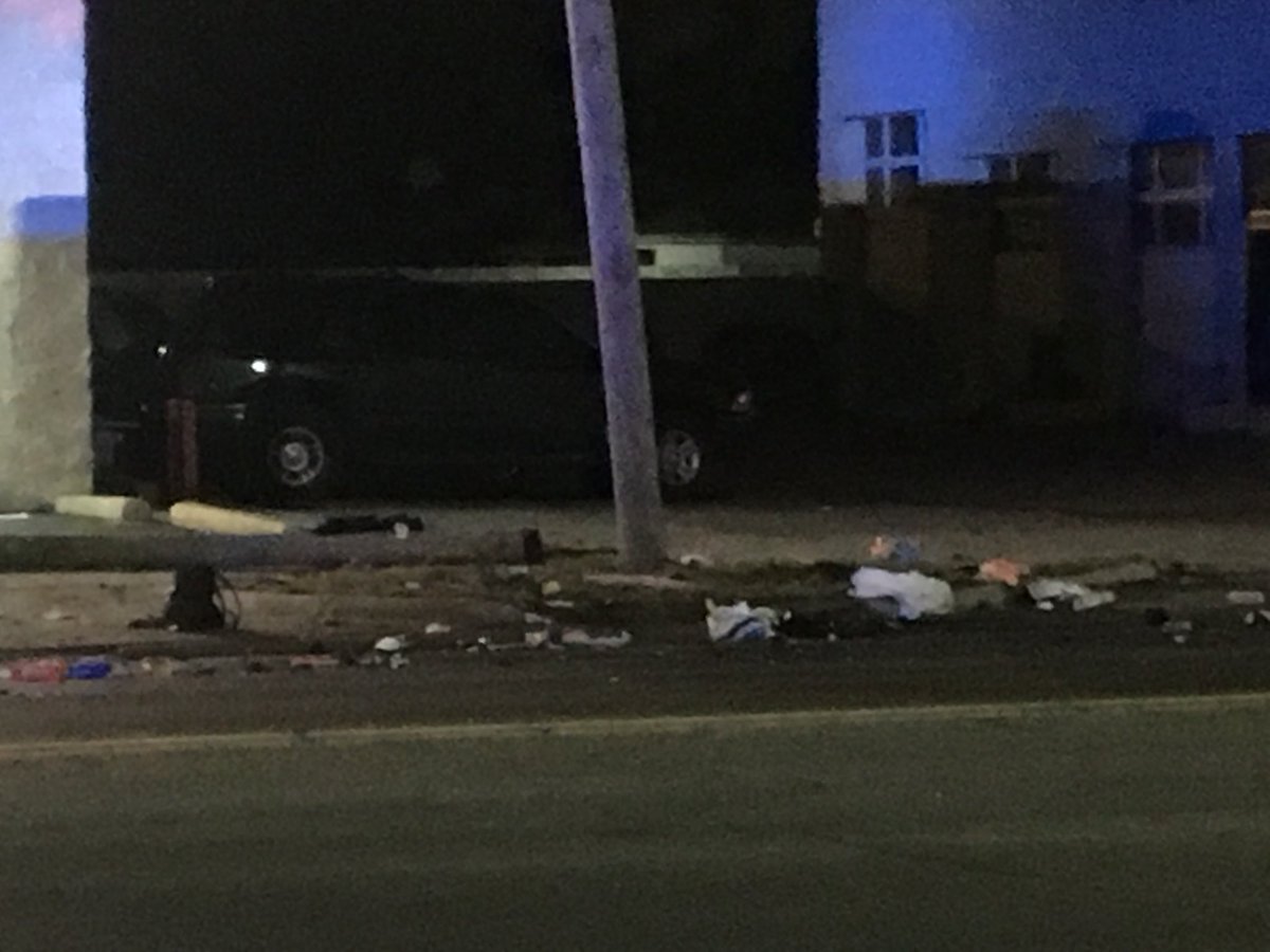 W Warren at Heyden, two blocks west of Evergreen, west side Detroit: Nissan sedan (burned) and Jeep Cherokee (upsidedown) collide, leaving trail of auto parts, backpack, shoe, snapped utility pole.
