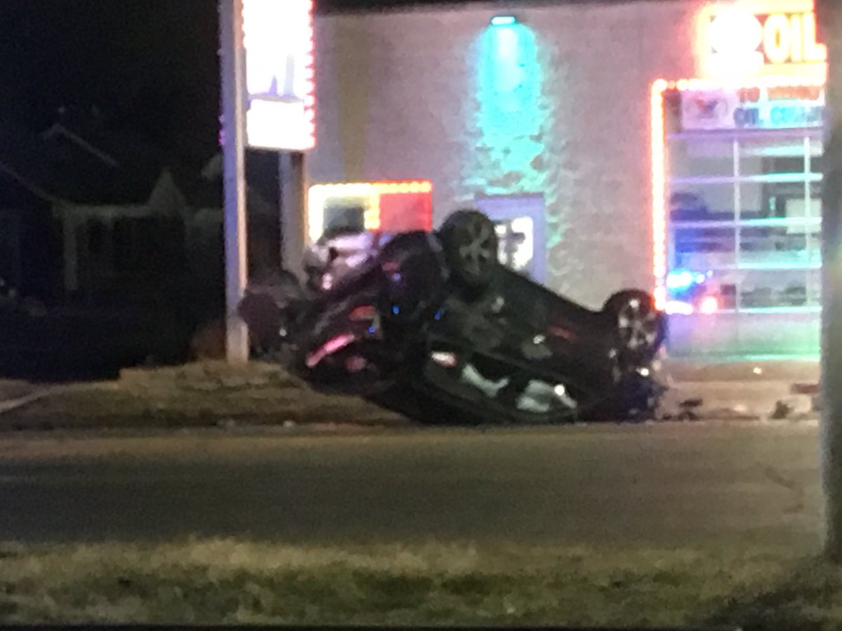 W Warren at Heyden, two blocks west of Evergreen, west side Detroit: Nissan sedan (burned) and Jeep Cherokee (upsidedown) collide, leaving trail of auto parts, backpack, shoe, snapped utility pole.