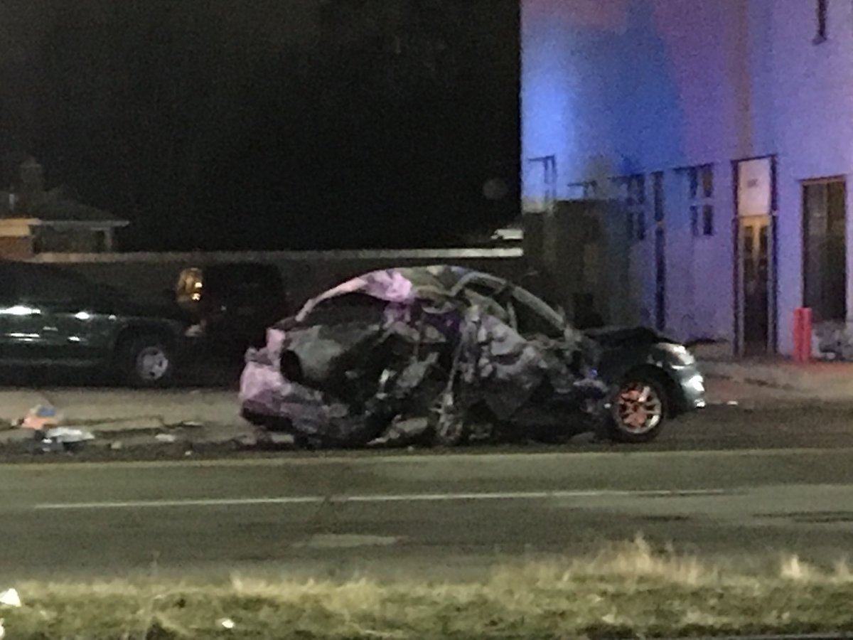 W Warren at Heyden, two blocks west of Evergreen, west side Detroit: Nissan sedan (burned) and Jeep Cherokee (upsidedown) collide, leaving trail of auto parts, backpack, shoe, snapped utility pole.