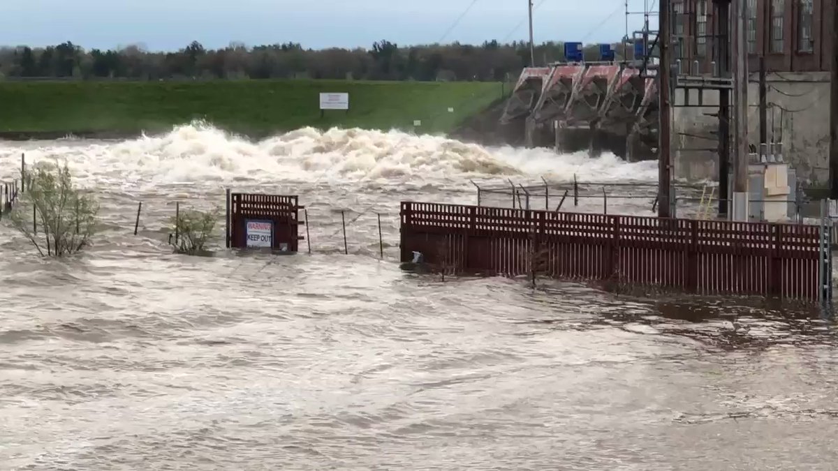 The water continues to rush out of the dam at Sanford Lake. Many who evacuated are now heading home to check on the damage