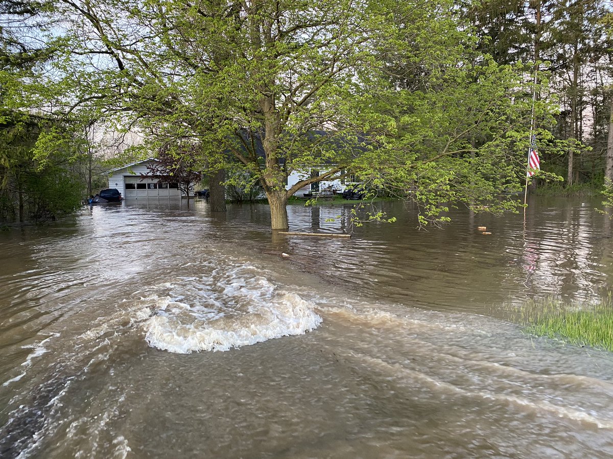 Devastating flooding near Midland.  Isabella Street. which is partially flooded itself. Homes behind are in at least three feet of water.