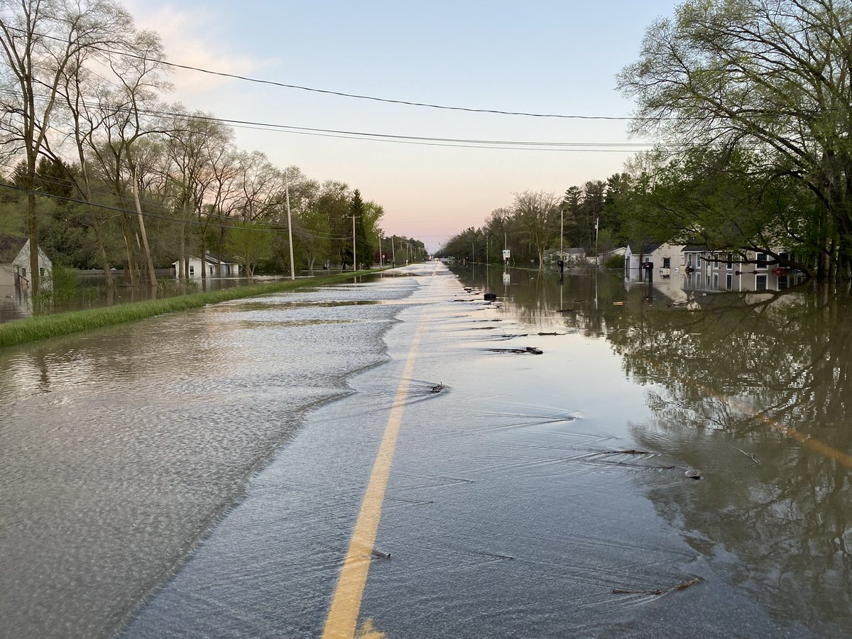 Devastating flooding near Midland.  Isabella Street. which is partially flooded itself. Homes behind are in at least three feet of water.