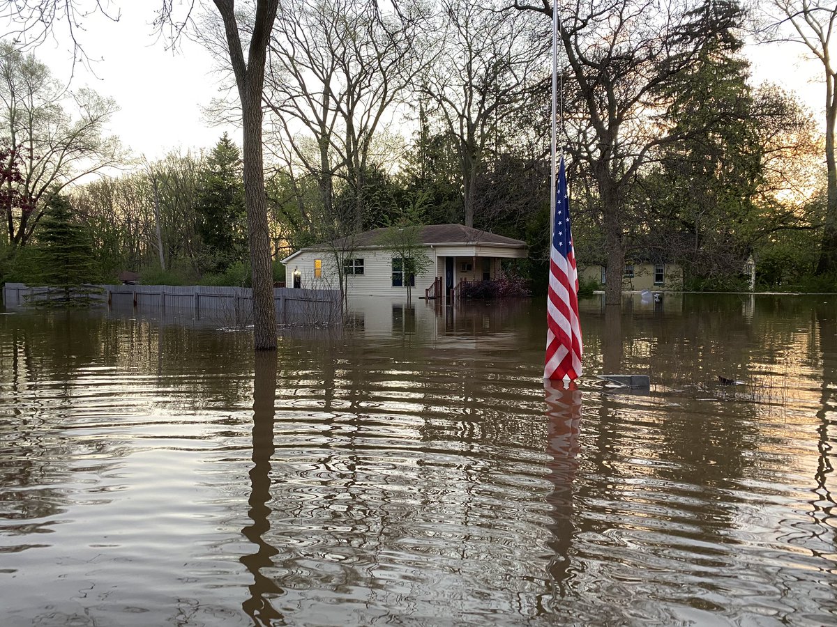 Devastating flooding near Midland.  Isabella Street. which is partially flooded itself. Homes behind are in at least three feet of water.