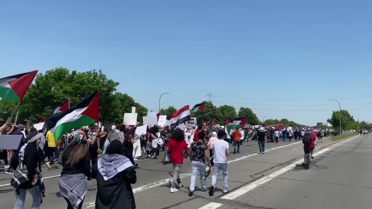 Protesters, now numbering near two thousand, take to Michigan Avenue for a march for Palestine here in Dearborn