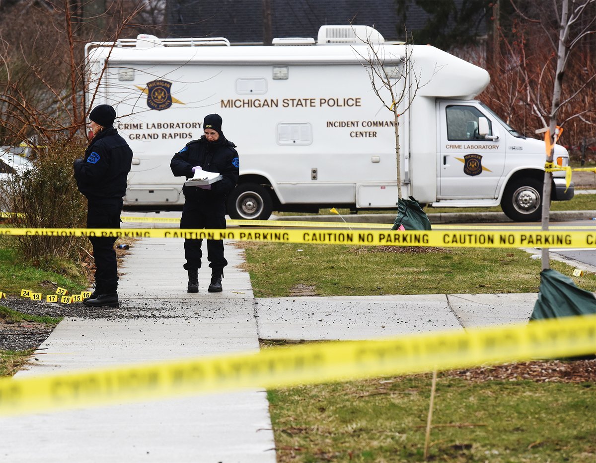 Michigan State Police continue to investigate the scene of a shooting in the 700 block of Highland Avenue in Benton Harbor Friday afternoon. A suspect was shot and killed and two Benton Harbor Department of Public Safety officers wounded during a shootout Thursday night