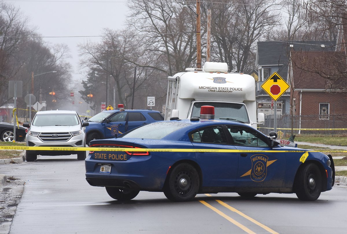 Michigan State Police continue to investigate the scene of a shooting in the 700 block of Highland Avenue in Benton Harbor Friday afternoon. A suspect was shot and killed and two Benton Harbor Department of Public Safety officers wounded during a shootout Thursday night