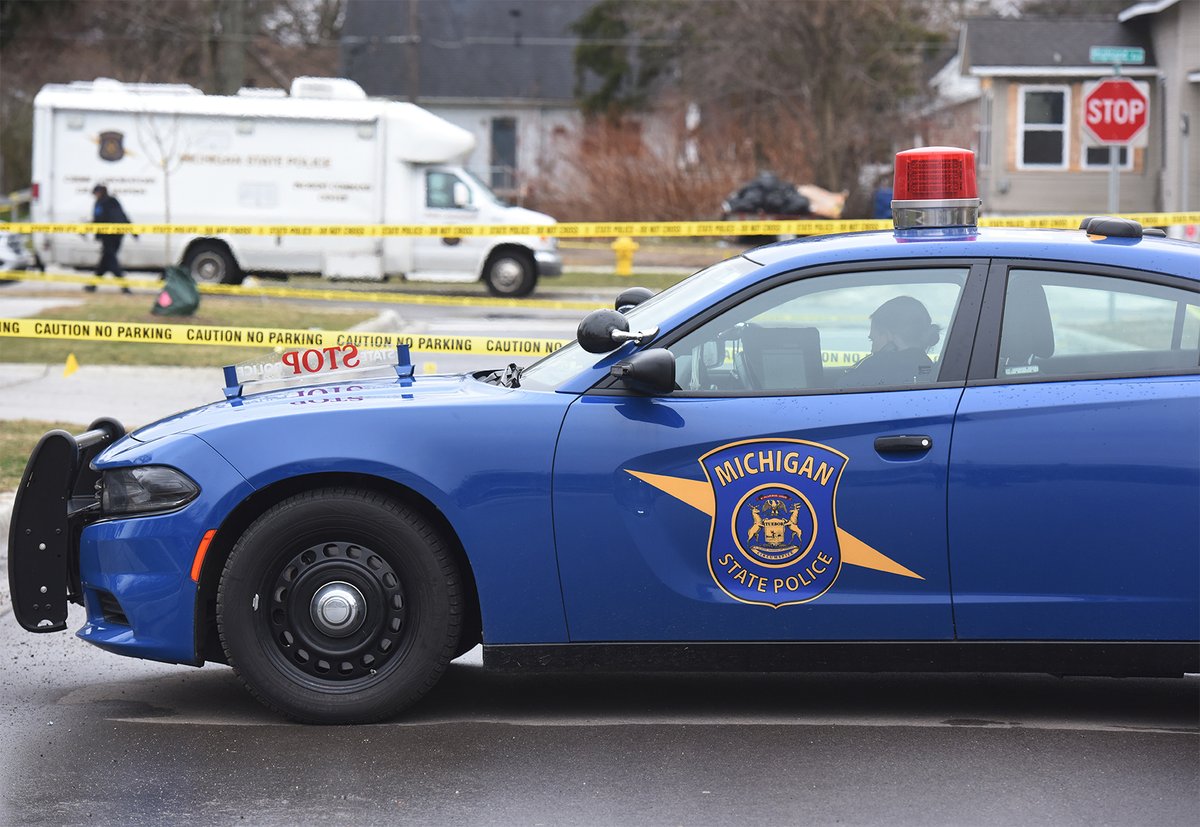 Michigan State Police continue to investigate the scene of a shooting in the 700 block of Highland Avenue in Benton Harbor Friday afternoon. A suspect was shot and killed and two Benton Harbor Department of Public Safety officers wounded during a shootout Thursday night