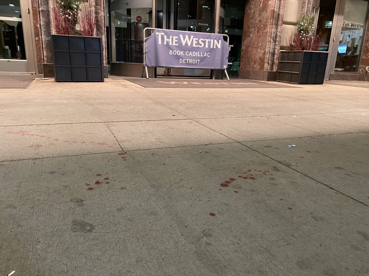 Shooting outside Westin Book-Cadillac Detroit downtown hotel; Four people hospitalized, at least two critical. SUV curbside on Washington Blvd at Michigan Ave about midnight is sprayed with bullets. Another SUV speeds away. 
